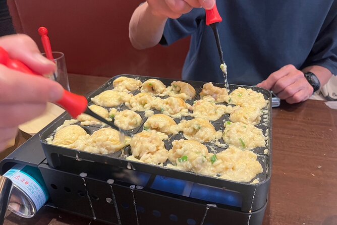 Experience Cooking Takoyaki in its Birthplace, Osaka - Eating the takoyaki while it is still hot