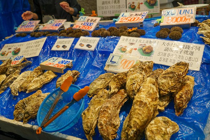 Kuromon Market Food Walking Tour in Osaka (6 stops, 6 tastes) - Passing Namba Grand Kagetsu and Namba