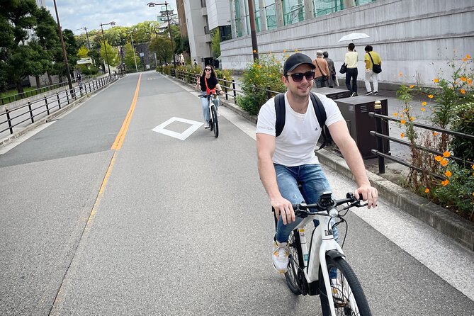Osaka E-Bike Tour With A Local Guide - Namba Yasaka Shrine ends with a giant lion