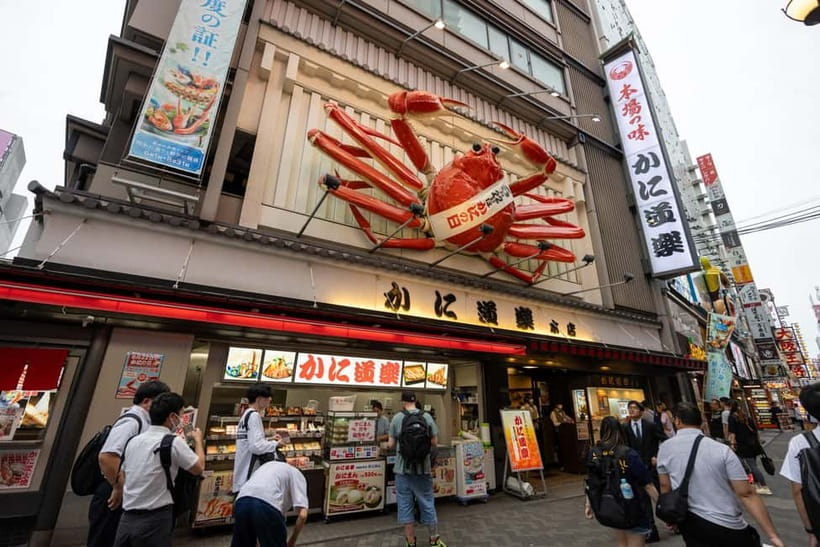 Osaka: Food Tour Kuromon Market & Dotonbori with Guide - Dotonbori after dark and the Glico sign