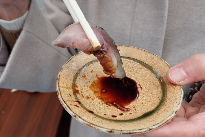 Osaka Food Tour with 10 Classic Japanese Tastings & Drinks - Udon, rice crackers, and the small details of Japanese snacking
