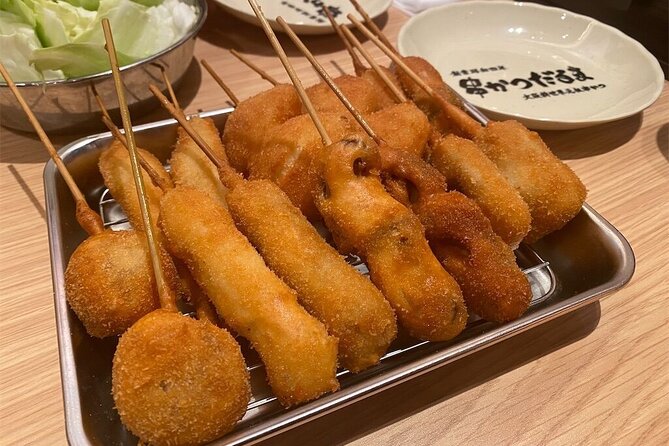 Osaka Highlights Walking Tour: Castle, Dotonbori & Hidden Gems - Kuromon Market makes food part of the lesson