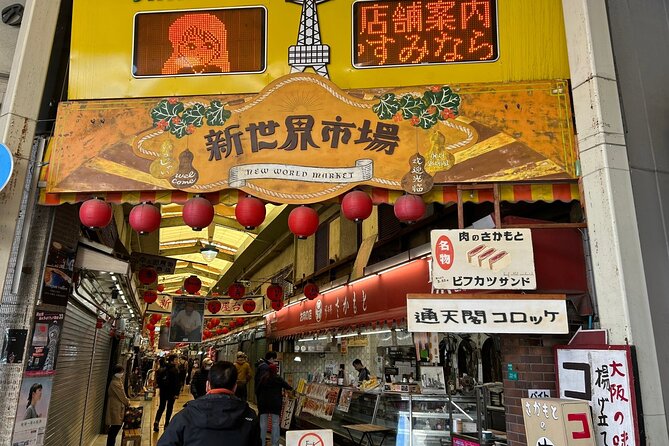 Osaka Highlights Walking Tour: Castle, Dotonbori & Hidden Gems - Tsutenkaku marks the turn toward retro Osaka