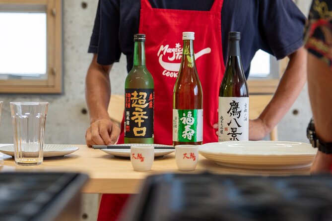 Osaka Home Feast Cooking and Sake Experience - Chicken, tuna, and a complete home-style spread
