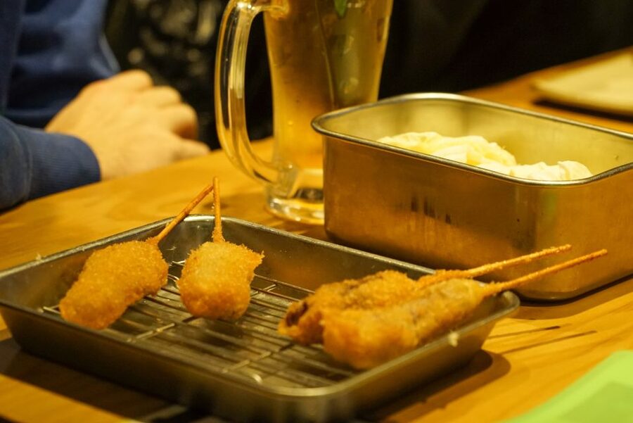 Osaka: Local Foodie Tour in Dotonbori and Shinsekai - Starting in Shinsekai beneath Tsutenkaku Tower