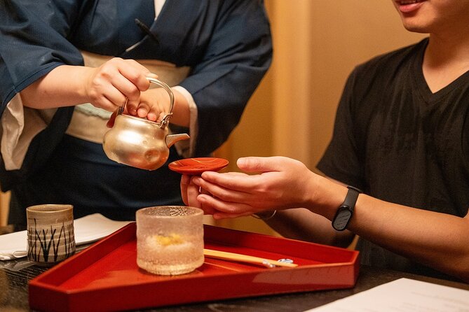 Osaka Michelin Food Tour Experience Kaiseki and Local dishes - Eating takoyaki in Amerikamura