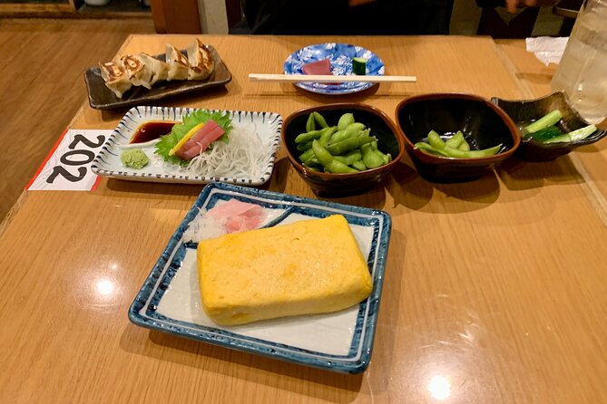 Osaka Nights: Ultimate Pub Bar Crawl with an Expert Local Guide - Stops two and three: drinks, shared dishes, and changing moods