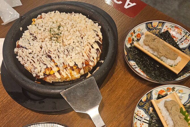 Osaka: Shinsekai Food Tour - 13 Dishes at 5 Local Eateries - Finishing beneath Tsutenkaku Tower