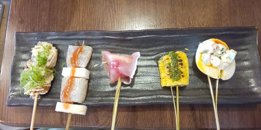 Osaka: Shinsekai Food Tour with 13-15 Dishes at 5 Eateries - What the guides add between the dishes