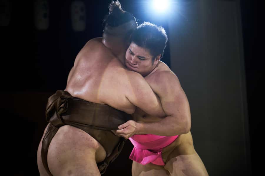 Osaka: Sumo Show & Experience w/ Optional Kimono & Hot Pot - Audience wrestling with a rikishi