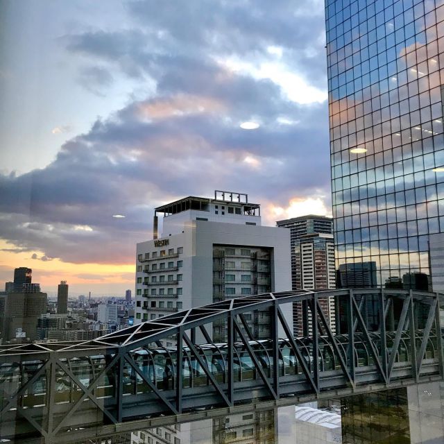 Osaka: Umeda Sky Building Official E-Ticket - The trip up: glass escalators and a futuristic setting