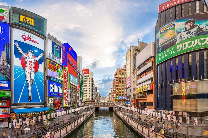 Osaka Unveiled Private Tour: Bustling Streets to Serene Shrines - Dotonbori delivers neon, food signs, and nightlife