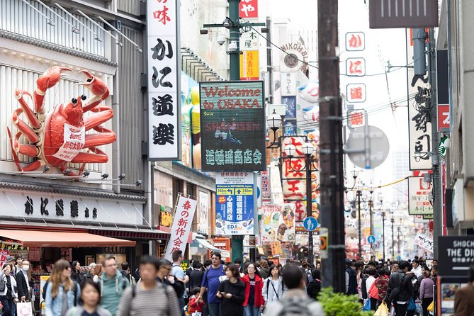 Shared Arrival Transfer: Osaka Itami Airport to Osaka City - The airport meeting point at Itami