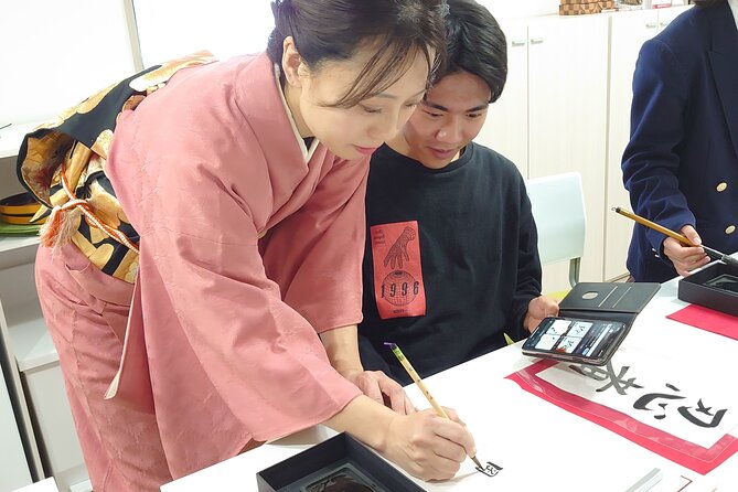 Traditional Calligraphy Experience near Dotonbori - Writing the final hanging scroll